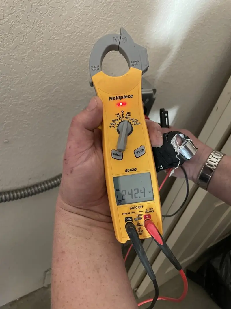 Voltage testing with clamp meter during Electrical Installation Services in Hendersonville